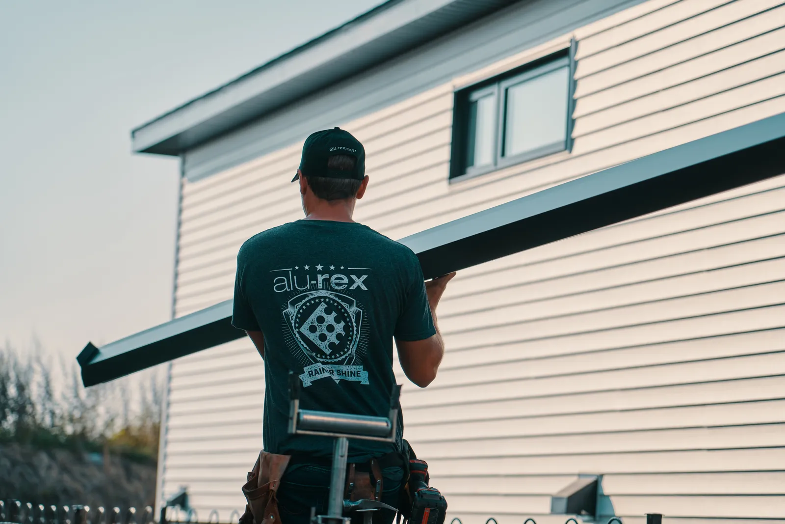 Seamless gutter installation from the ladder — Precision Works Gutters, south-central Georgia BC